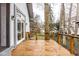Spacious back deck with wooden railing and partial wooded view at 5508 Bay Landing Cir, Indianapolis, IN 46254