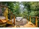 Back deck with outdoor seating area and wooded background at 5508 Bay Landing Cir, Indianapolis, IN 46254