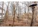 Home with lush backyard featuring mature trees and bird feeders at 5508 Bay Landing Cir, Indianapolis, IN 46254