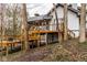 Exterior shot of the deck off the back of the home shows wooden stairs, railings, and a screened porch at 5508 Bay Landing Cir, Indianapolis, IN 46254