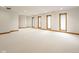 Spacious basement with multiple windows, neutral walls, and plush carpeting at 5508 Bay Landing Cir, Indianapolis, IN 46254