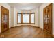 Bedroom with ample natural light from bay window and stylish wood flooring at 5508 Bay Landing Cir, Indianapolis, IN 46254