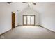 Bright bedroom with vaulted ceiling, large windows, carpet flooring, and a neutral color palette at 5508 Bay Landing Cir, Indianapolis, IN 46254