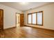 Bright bedroom with wood floors, trim and a window at 5508 Bay Landing Cir, Indianapolis, IN 46254