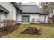 Exterior shot of the side of the home features solar panels, a garden, and a single-car garage at 5508 Bay Landing Cir, Indianapolis, IN 46254