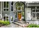 The front entryway features a custom wood door, detailed windows and brick steps at 5508 Bay Landing Cir, Indianapolis, IN 46254