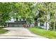 Beautiful gray two-story home boasts a three-car garage and lush landscaping at 5508 Bay Landing Cir, Indianapolis, IN 46254