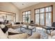 The living room boasts a vaulted ceiling, hardwood floors and large windows at 5508 Bay Landing Cir, Indianapolis, IN 46254