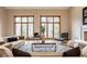 The living room boasts a vaulted ceiling, hardwood floors and large windows at 5508 Bay Landing Cir, Indianapolis, IN 46254