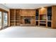 Inviting living room with brick fireplace, wood beam mantle, and built-in cabinets at 5508 Bay Landing Cir, Indianapolis, IN 46254