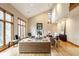 This open-concept living room boasts natural light, a vaulted ceiling and a fireplace at 5508 Bay Landing Cir, Indianapolis, IN 46254