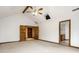 Spacious primary bedroom with vaulted ceiling, ceiling fan, and double-door access to ensuite bathroom at 5508 Bay Landing Cir, Indianapolis, IN 46254