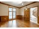 Office with wood-paneled walls, large window, and views of the outside at 5508 Bay Landing Cir, Indianapolis, IN 46254