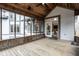 Inviting porch with wood flooring, screen windows, and a ceiling fan for comfort and relaxation at 5508 Bay Landing Cir, Indianapolis, IN 46254