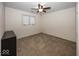 Simple bedroom with carpeted floors and ceiling fan at 8207 Shorewalk Dr, Indianapolis, IN 46236