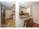 Kitchen with a breakfast bar, granite countertops, and stainless steel appliances at 8207 Shorewalk Dr, Indianapolis, IN 46236