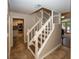 View of a staircase leading to the second floor, with kitchen and living room visible at 8207 Shorewalk Dr, Indianapolis, IN 46236
