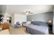 Main bedroom with large bed, ceiling fan, and dresser at 8331 Firefly Way, Indianapolis, IN 46259