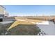 Fenced backyard with patches of snow at 8576 Jeff Cir, Brownsburg, IN 46112