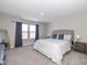 Spacious primary bedroom featuring a large bed and ample natural light at 8576 Jeff Cir, Brownsburg, IN 46112