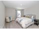 Cozy bedroom with a queen bed and an adjacent sitting chair at 8576 Jeff Cir, Brownsburg, IN 46112