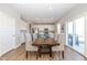 Dining area with a wood table and access to the back patio at 8576 Jeff Cir, Brownsburg, IN 46112