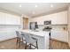 Modern kitchen with white cabinets, quartz countertops, and island at 8576 Jeff Cir, Brownsburg, IN 46112