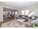 Open concept living room with kitchen view and large windows at 8576 Jeff Cir, Brownsburg, IN 46112