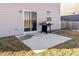 Small patio with grill, adjacent to grassy yard at 8576 Jeff Cir, Brownsburg, IN 46112