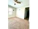 Spacious bedroom with carpeted floor and access to hallway at 1520 Wilford Ln, Indianapolis, IN 46229