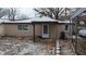 Tan house with snow covered yard and small covered porch at 3 Lake Hart, Mooresville, IN 46158