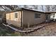 Tan house with snow covered yard, side view at 3 Lake Hart, Mooresville, IN 46158