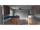Bright kitchen featuring ample cabinetry and a corner sink at 3 Lake Hart, Mooresville, IN 46158