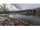 Snow dusted lakefront property with boats and serene winter landscape at 3 Lake Hart, Mooresville, IN 46158