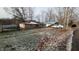 Small, charming lakefront cottage with a carport and snowy yard at 3 Lake Hart, Mooresville, IN 46158