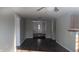 Open living area with dark hardwood floors and view to entry at 3 Lake Hart, Mooresville, IN 46158