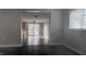Open living room with dark hardwood floors and access to kitchen at 3 Lake Hart, Mooresville, IN 46158
