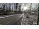 Residential street lined with trees and homes, light dusting of snow at 3 Lake Hart, Mooresville, IN 46158