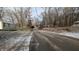 Residential street with snow-covered yards and charming homes at 3 Lake Hart, Mooresville, IN 46158