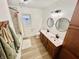 Updated bathroom with double vanity, modern fixtures, and a bathtub at 3305 S New Jersey St, Indianapolis, IN 46227