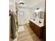 Updated bathroom with double vanity, modern fixtures, and a bathtub at 3305 S New Jersey St, Indianapolis, IN 46227