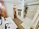 Clean bathroom with double vanity, bathtub, and updated finishes at 3305 S New Jersey St, Indianapolis, IN 46227