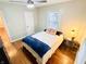 Bright bedroom with hardwood floors and a cozy bed at 3305 S New Jersey St, Indianapolis, IN 46227
