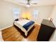 Bright bedroom with hardwood floors, a double bed, and ample natural light at 3305 S New Jersey St, Indianapolis, IN 46227