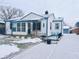 Charming ranch home with a snow-covered yard and a welcoming front porch at 3305 S New Jersey St, Indianapolis, IN 46227