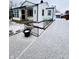 Front view of a ranch home with a snow-covered driveway and landscaping at 3305 S New Jersey St, Indianapolis, IN 46227