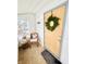 Inviting front porch with wreath, chair, and side table at 3305 S New Jersey St, Indianapolis, IN 46227