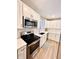 Modern kitchen with stainless steel appliances and white shaker cabinets at 3305 S New Jersey St, Indianapolis, IN 46227
