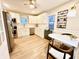 Updated kitchen with white cabinets, stainless steel appliances, and light wood floors at 3305 S New Jersey St, Indianapolis, IN 46227