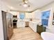 Updated kitchen with white cabinets, stainless steel appliances, and light wood floors at 3305 S New Jersey St, Indianapolis, IN 46227